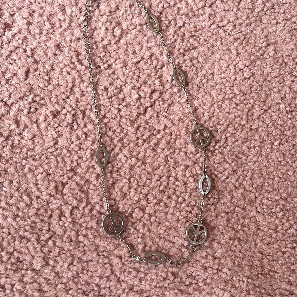Silver necklace with peace signs